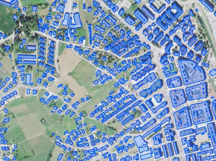 Building footprints mapped over satellite imagery